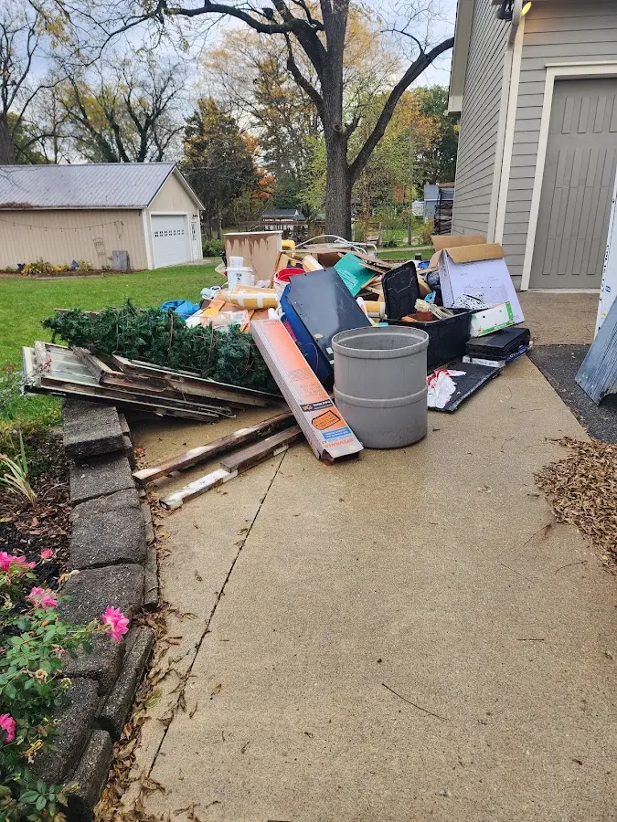 Dumpster being loaded with debris for 30 Yard Dumpster Rental in Cambridge